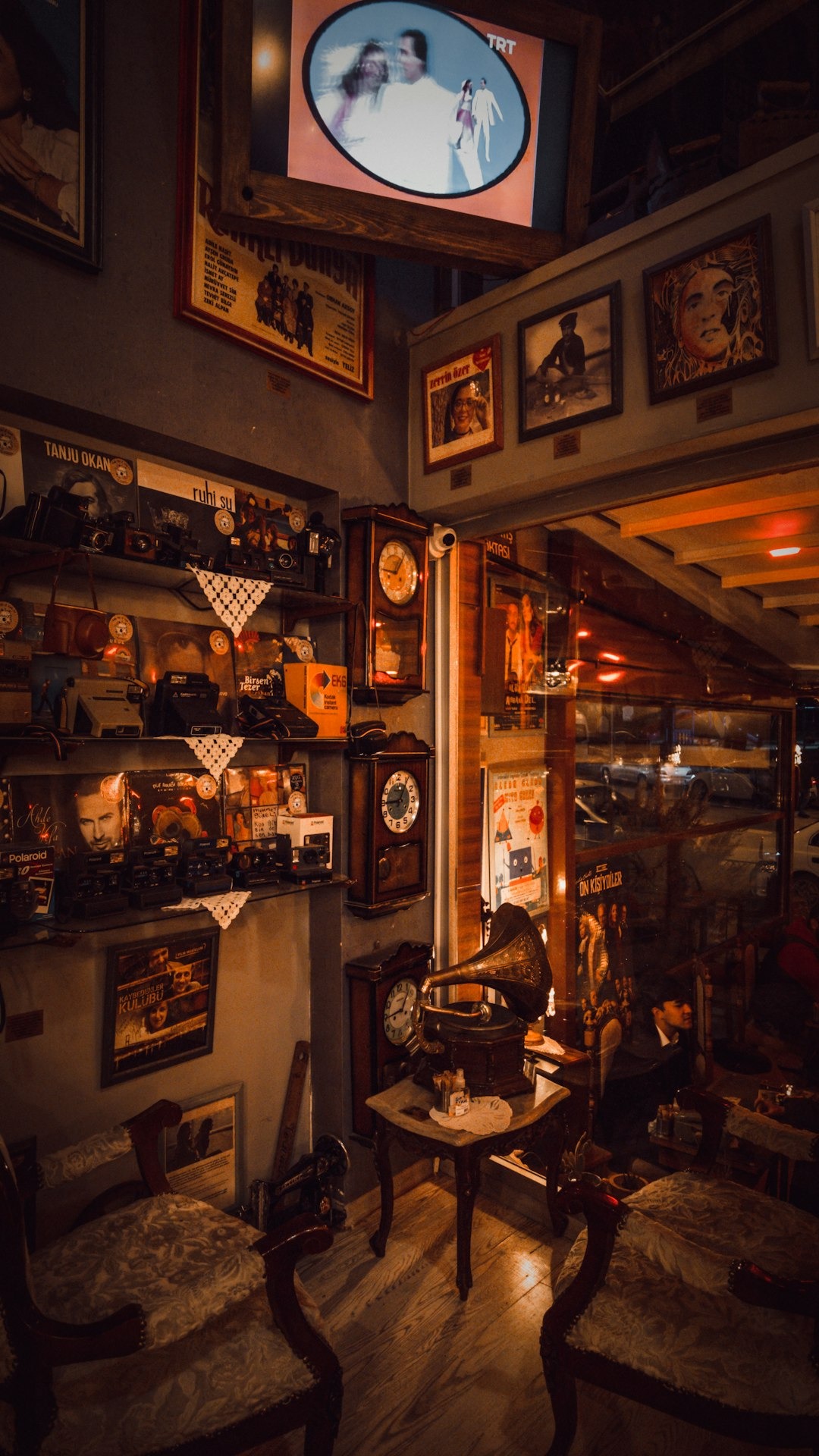 Antique gramophone and vintage decor inside a small shop.